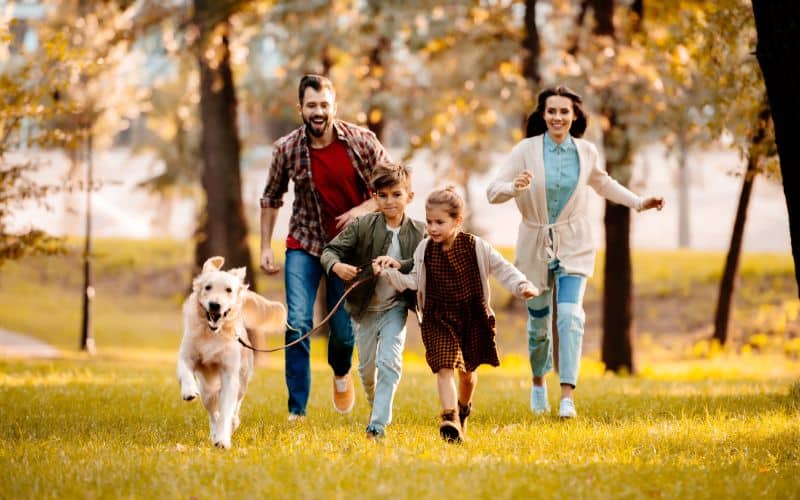 Dog-Supplements-Happy-Family-With-Two-Children-Running-After-A-Dog-Together-Min