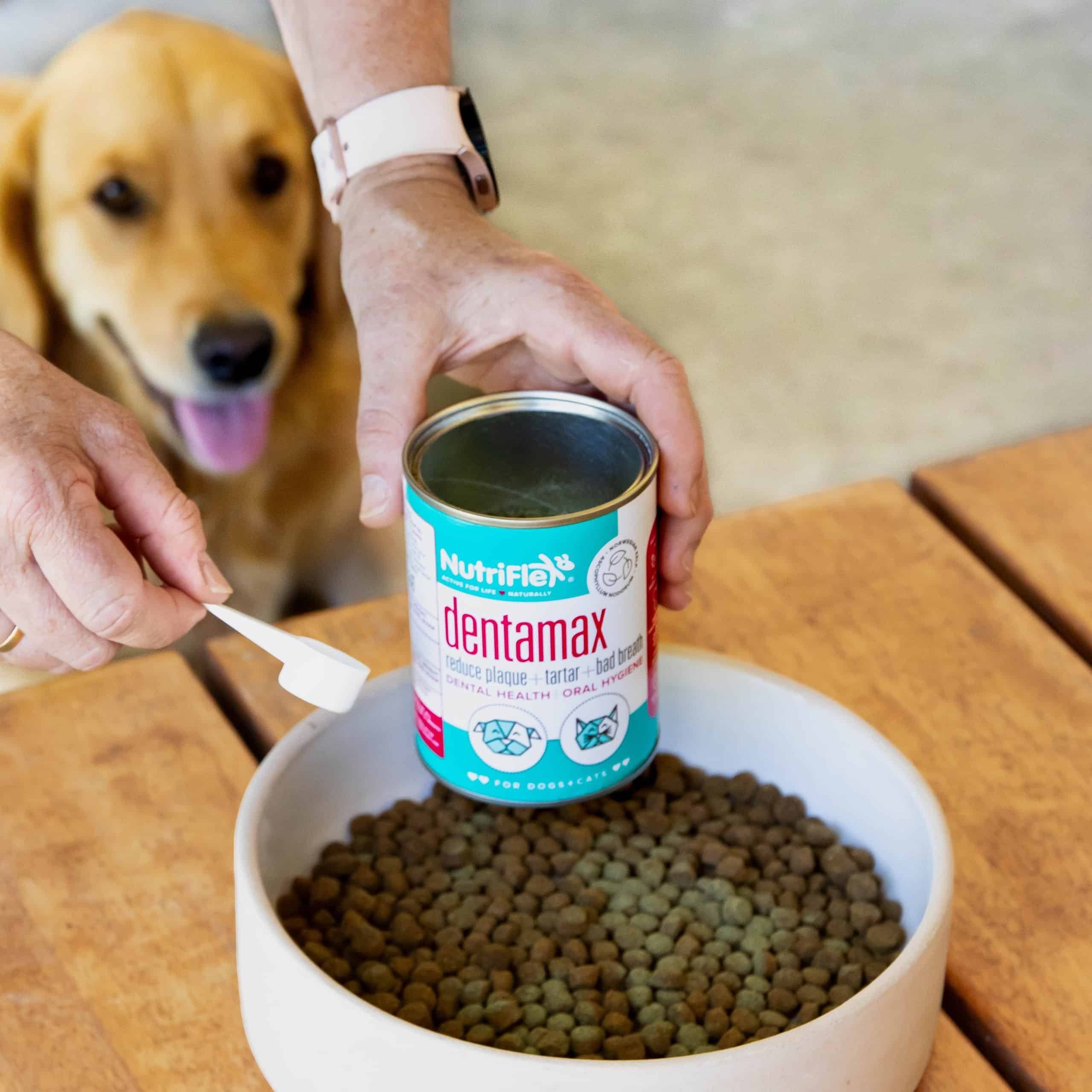 Sprinkle the recommended amount of DentaMax powder over your pets food once daily